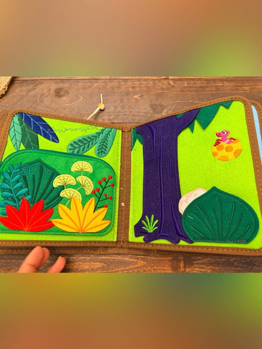 Pinkfong My First Book T-Rex, a Montessori-inspired interactive fabric busy book